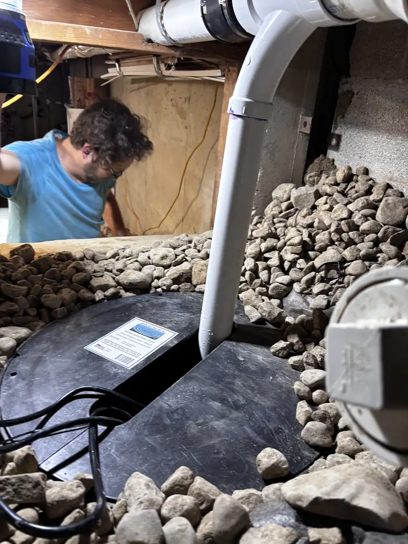 Pop-up emitter set flush in a lawn at the end of a buried downspout line