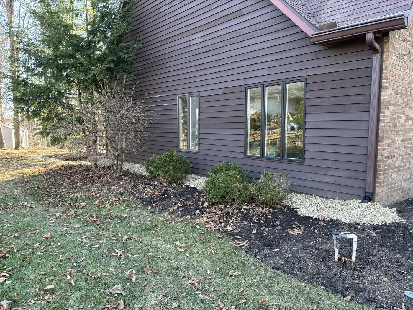A drain line hand-cut along the side of a Marion County ranch home carrying water away from the foundation