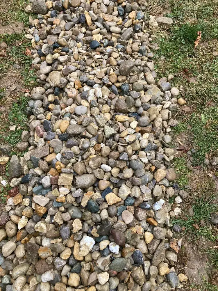 Strip of river rock set into a lawn